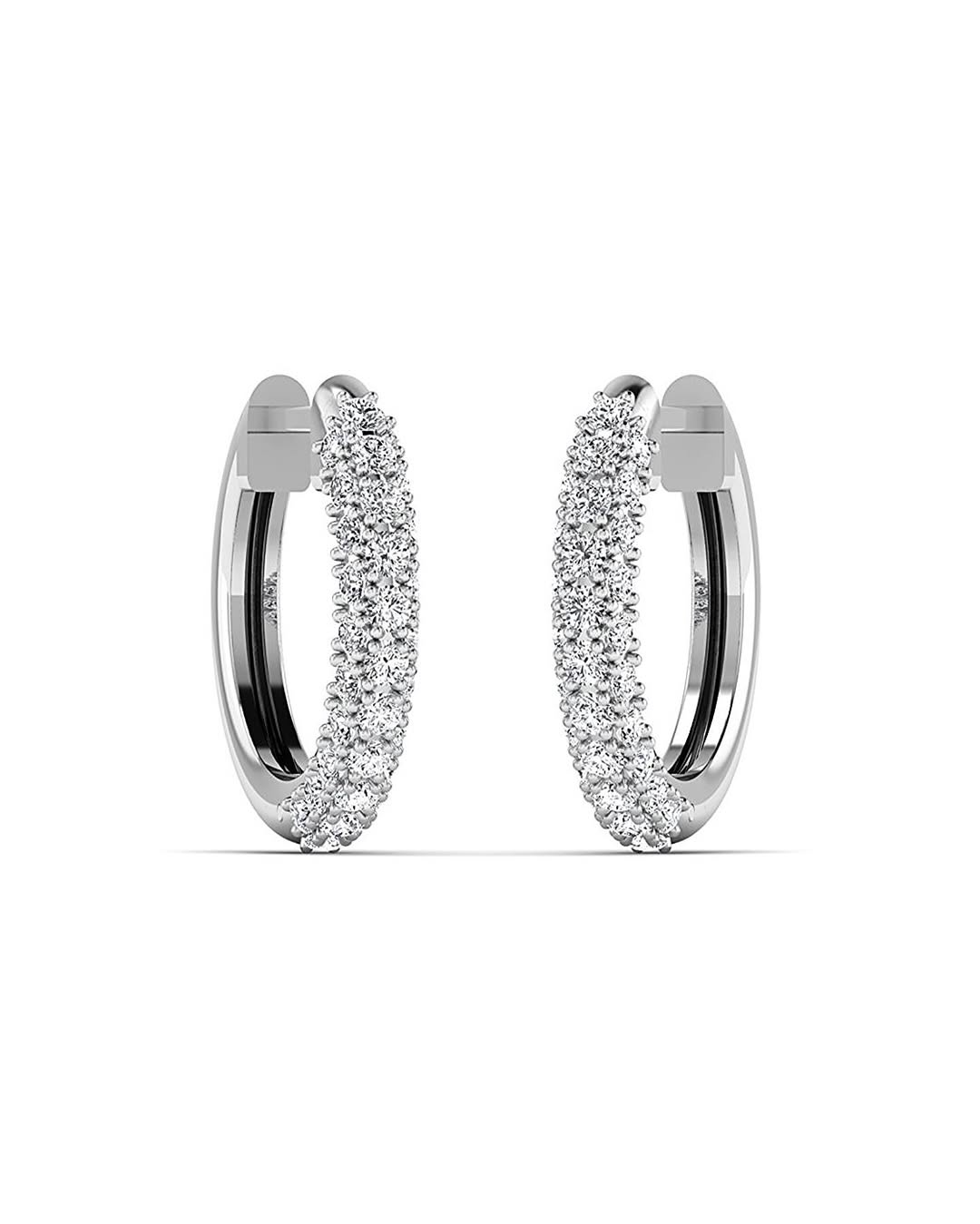 A pair of 18K gold hoop earrings with diamond accents.