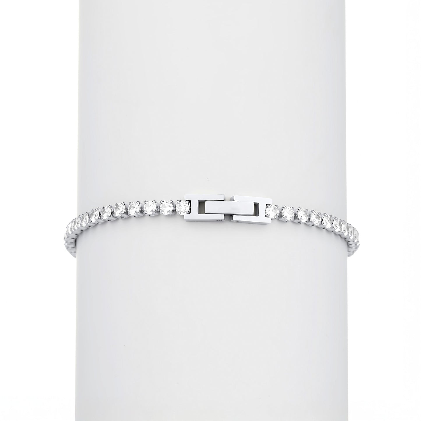 Silver bracelet with clear stones on a white background