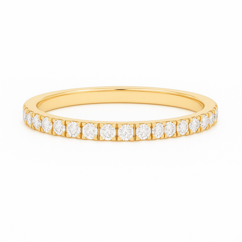 Gold ring with small diamonds on a white background