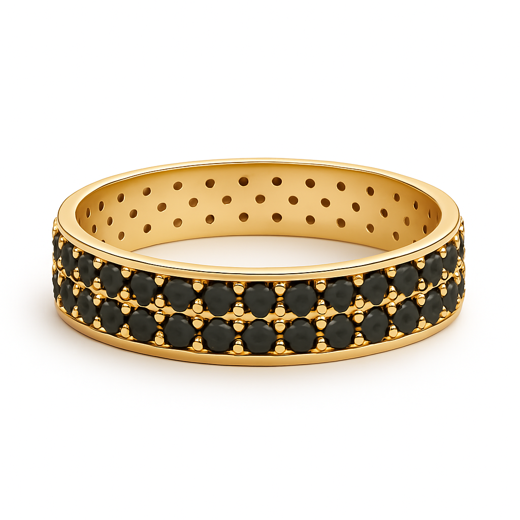 Gold ring with black gemstones on a white background