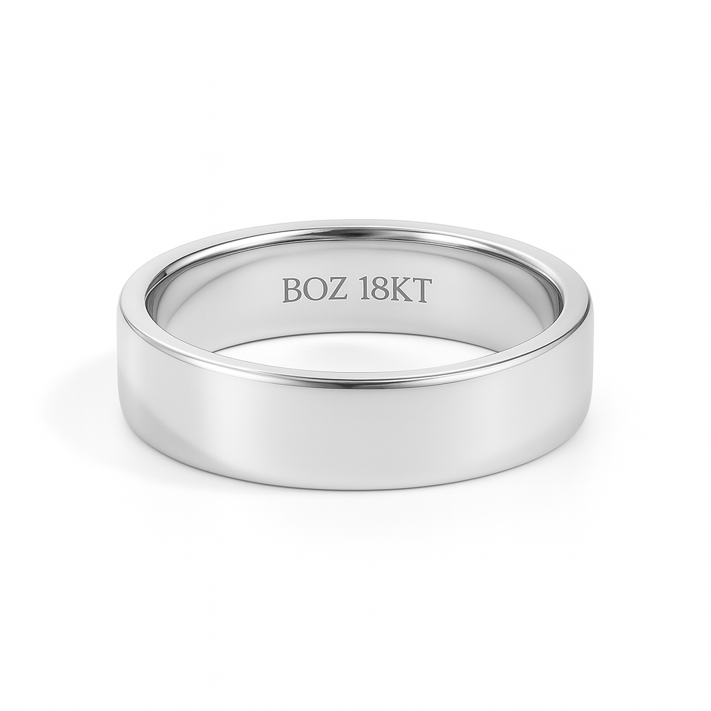 Silver ring with 'BOZ 18KT' engraving on a white background