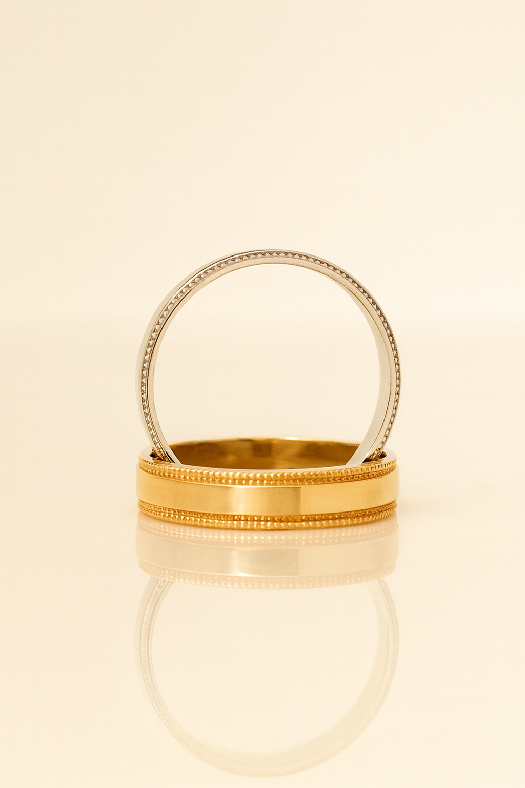 Gold-rimmed glass container on a beige background