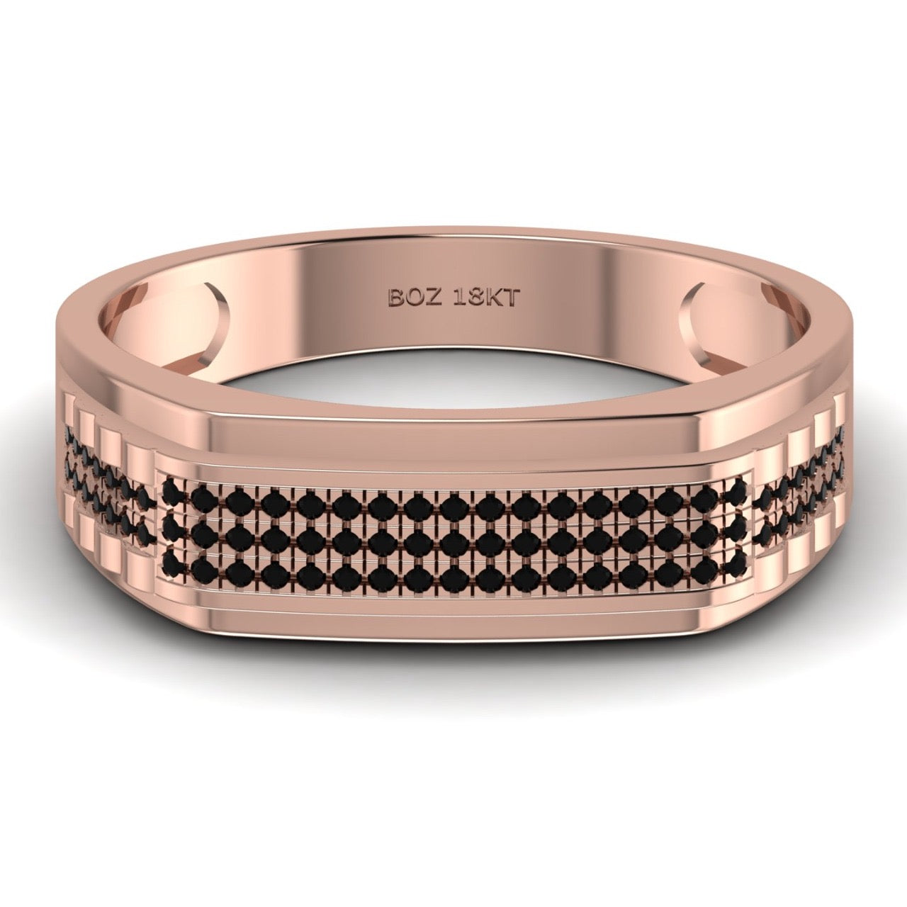 A gold band ring with black diamond pave pattern.