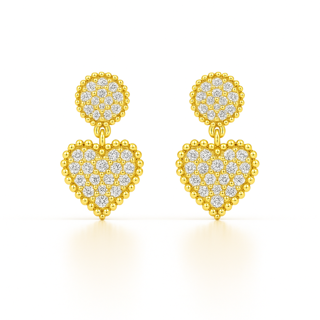 Gold heart-shaped earrings with diamond accents on a white background
