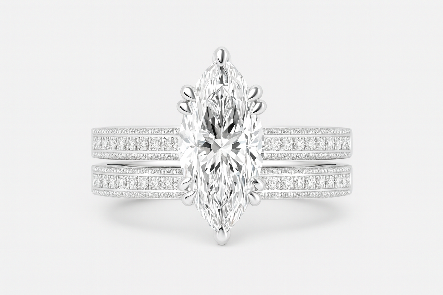 Diamond ring with a marquise-shaped center stone on a white background