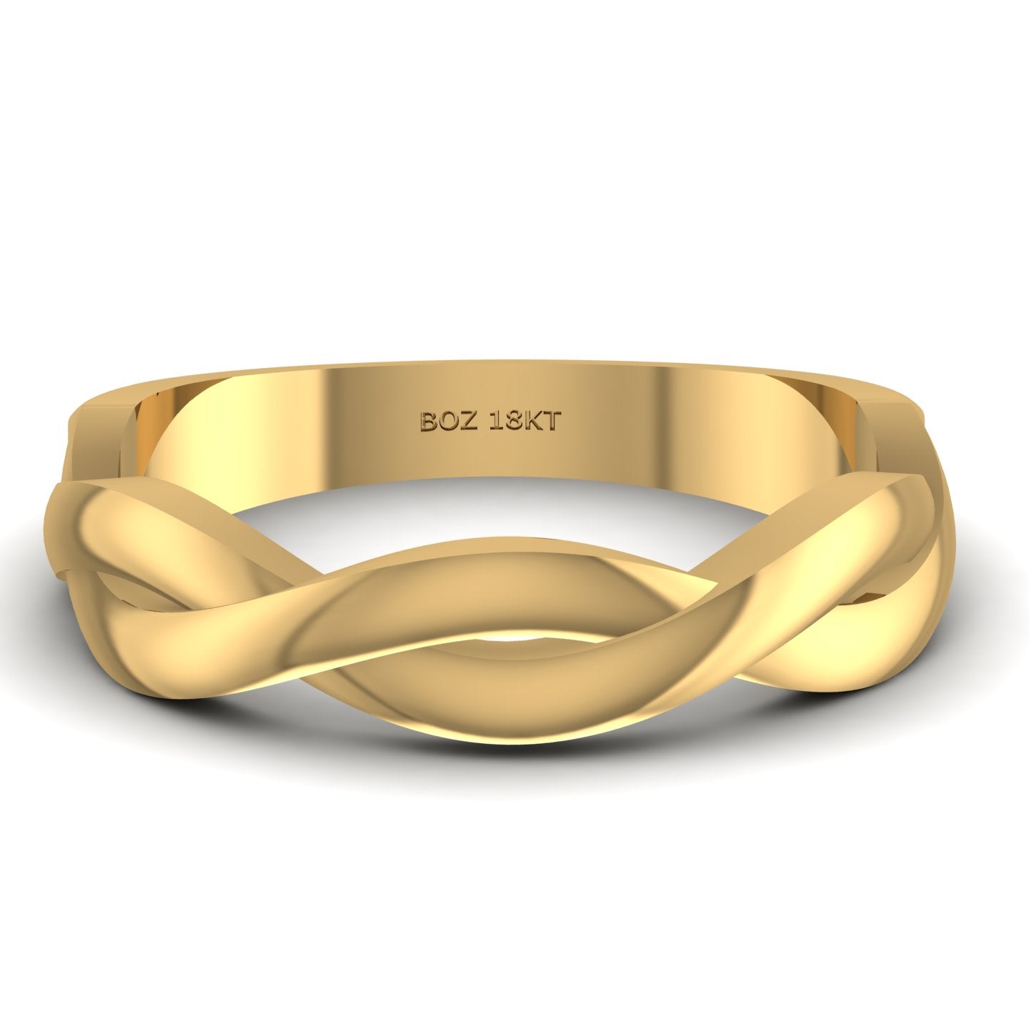 Gold ring with braided design on a white background