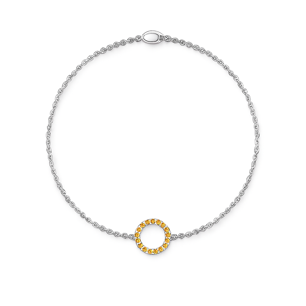 Silver bracelet with a yellow circular charm on a white background