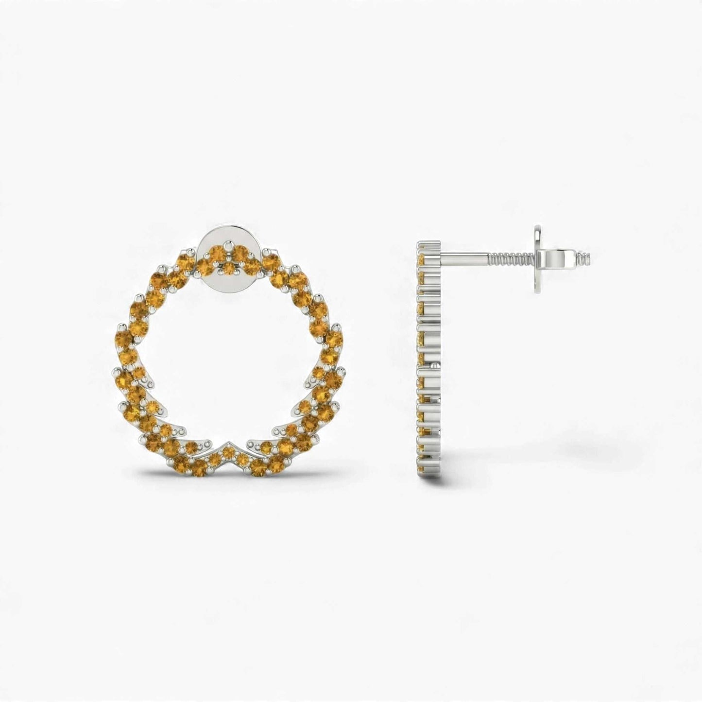 Hoop earrings with yellow gemstones on a white background