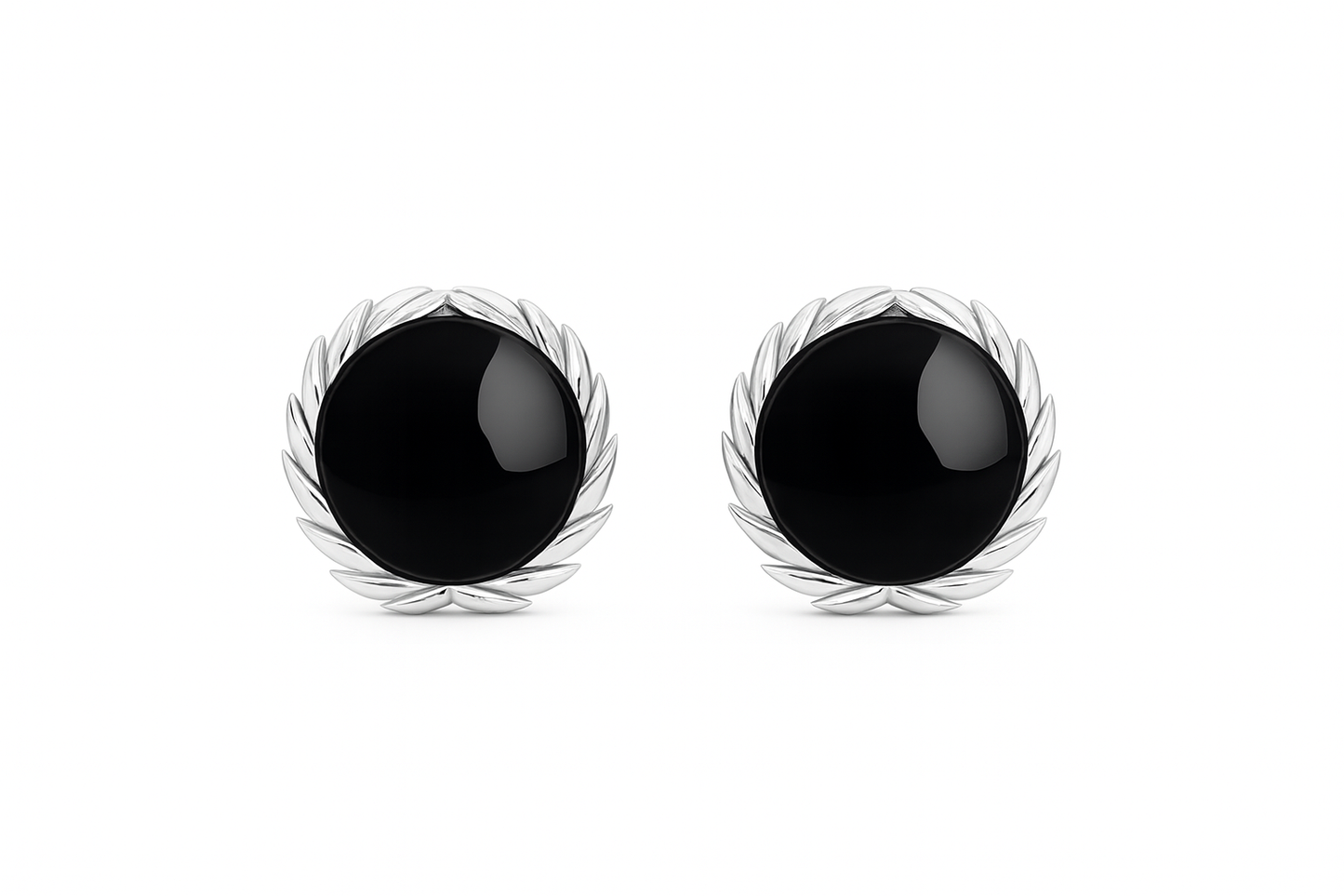 Pair of black earrings with silver leaf-like designs on a white background
