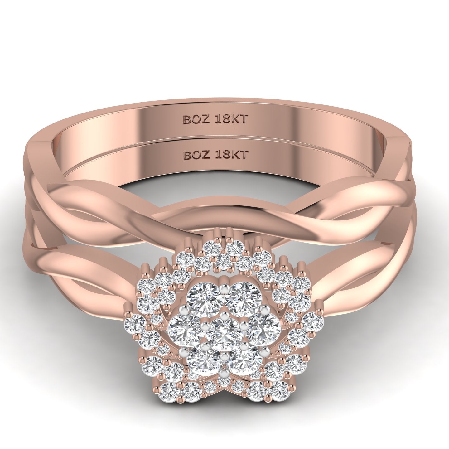 A set of two 18K gold rings with natural diamonds set in them, indicating a bridal set design.