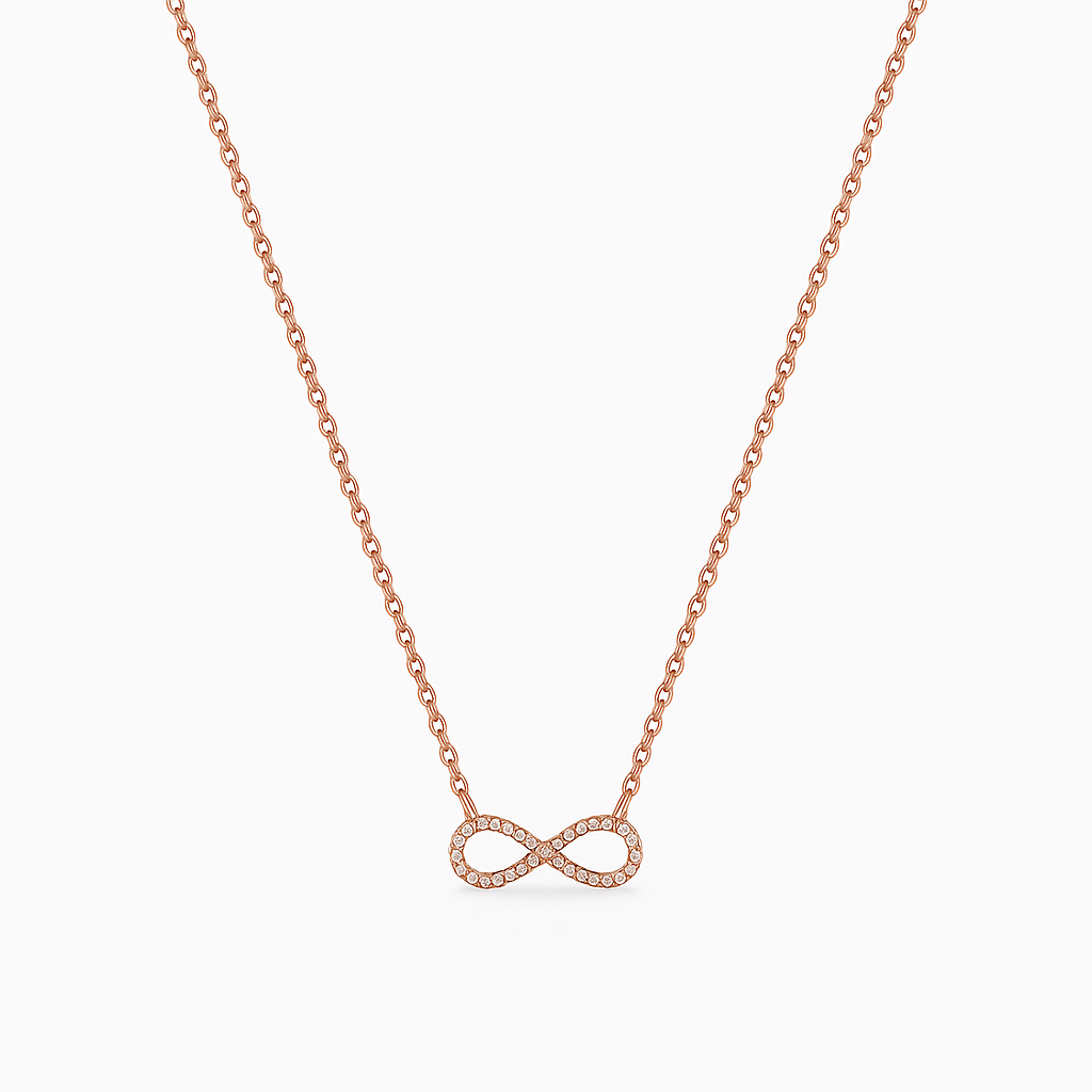 Rose gold infinity necklace on a white background