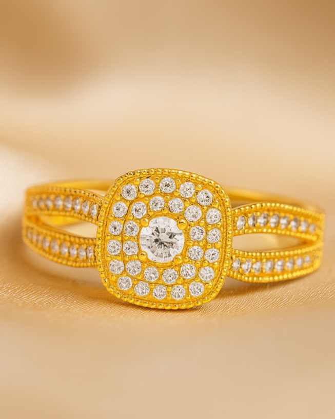 Gold ring with diamond accents on a beige background