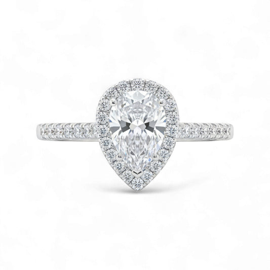 Diamond ring with pear-shaped center stone on a white background