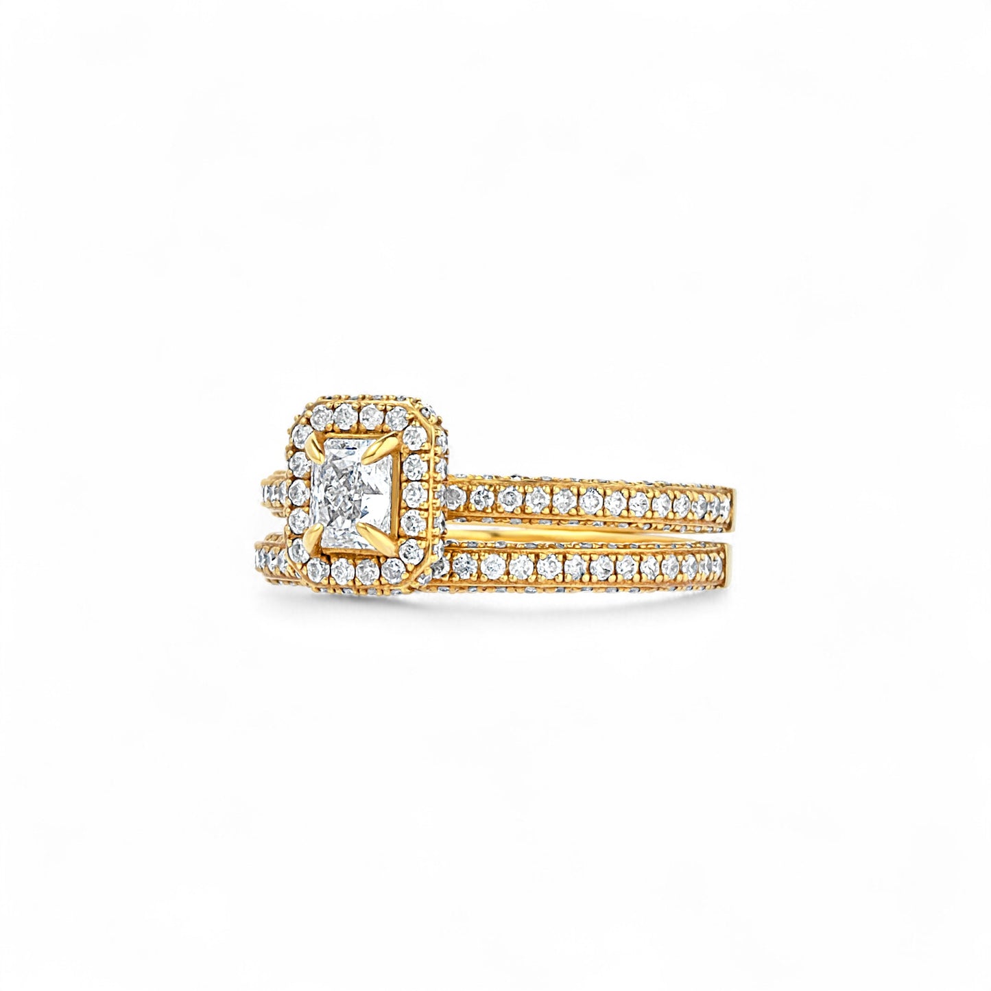 Gold ring with diamond accents on a white background