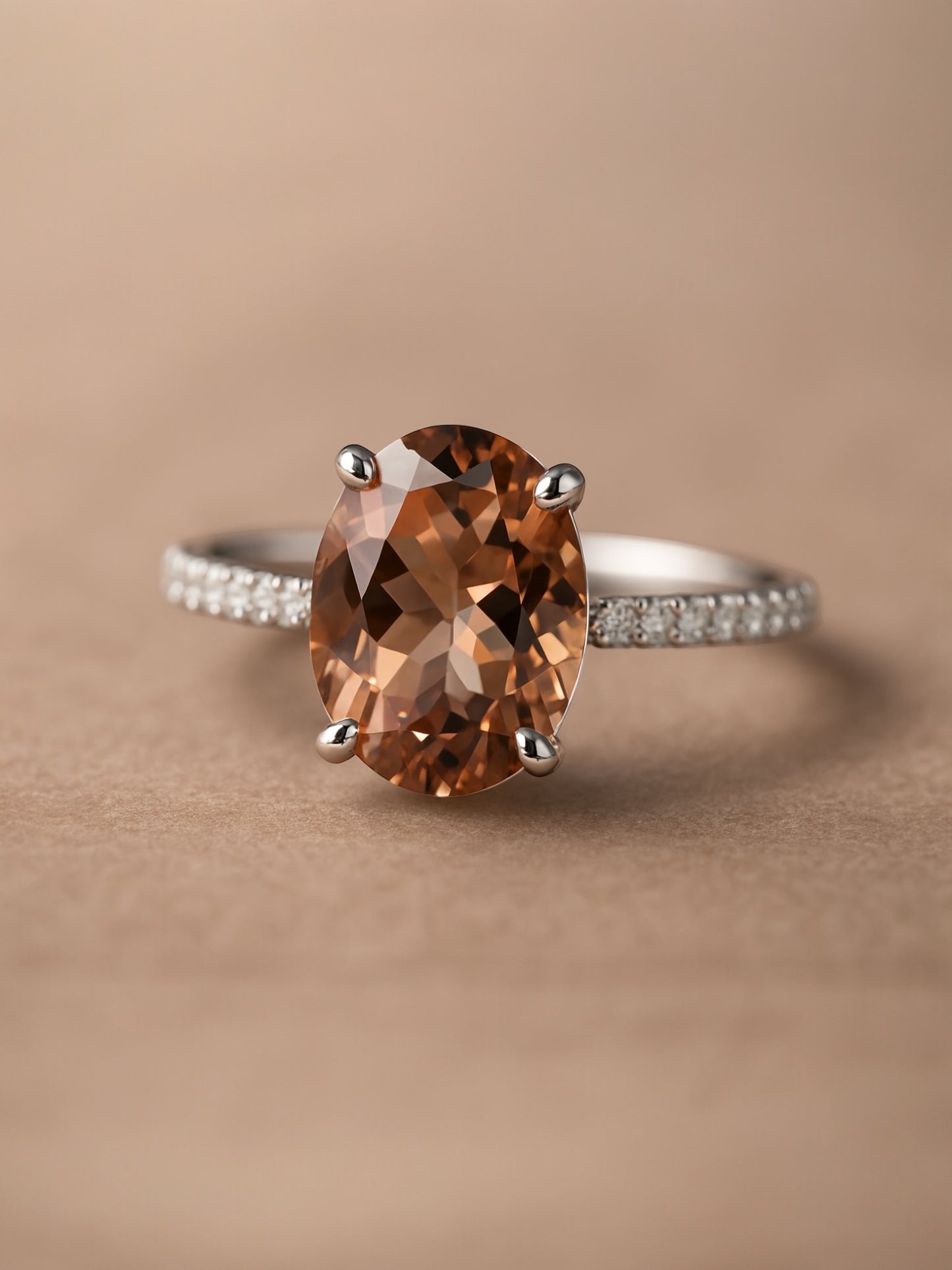 Ring with a brown gemstone on a beige background