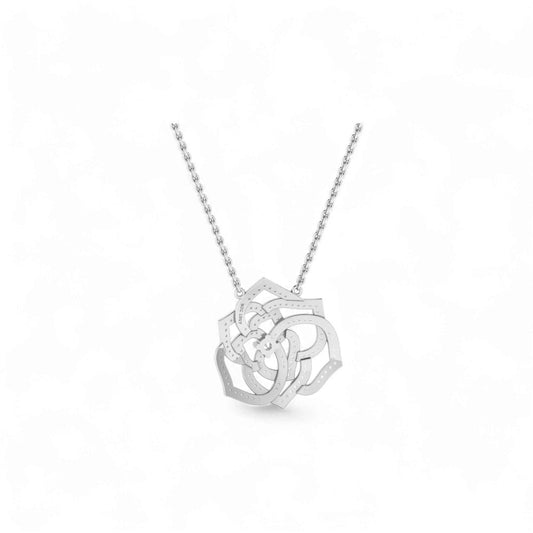 Silver necklace with a intricate pendant on a white background