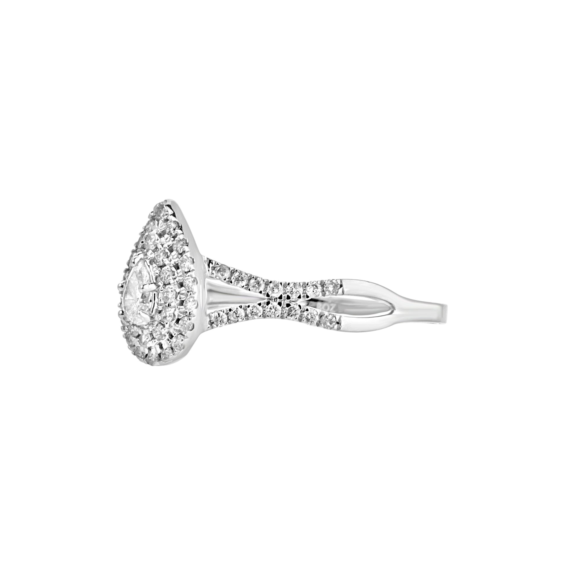 Diamond ring with a halo setting on a white background
