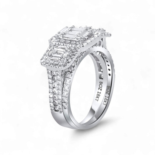 Diamond ring with emerald-cut center stone on a white background