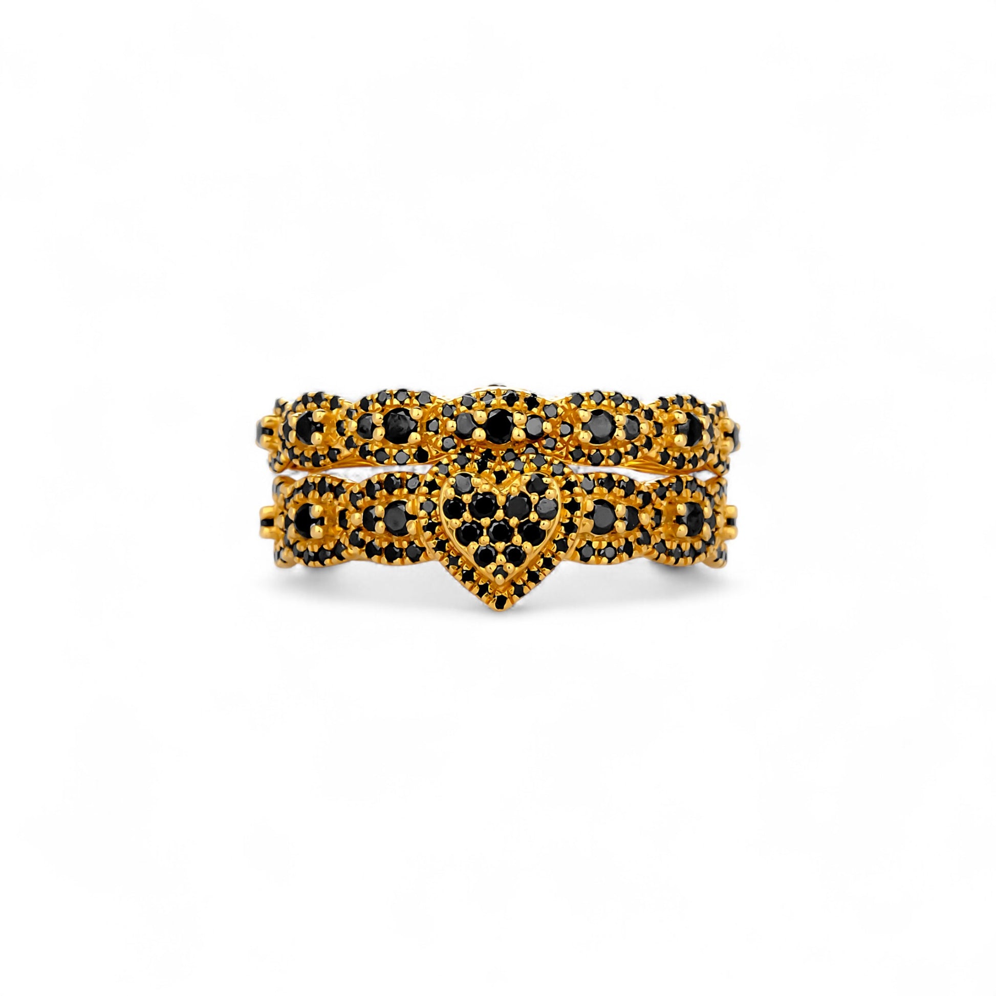 Gold and black gemstone ring on a white background