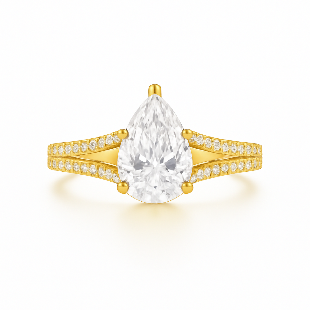 Gold ring with a pear-shaped diamond on a white background