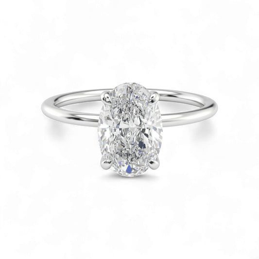 Diamond ring with a white gemstone on a white background