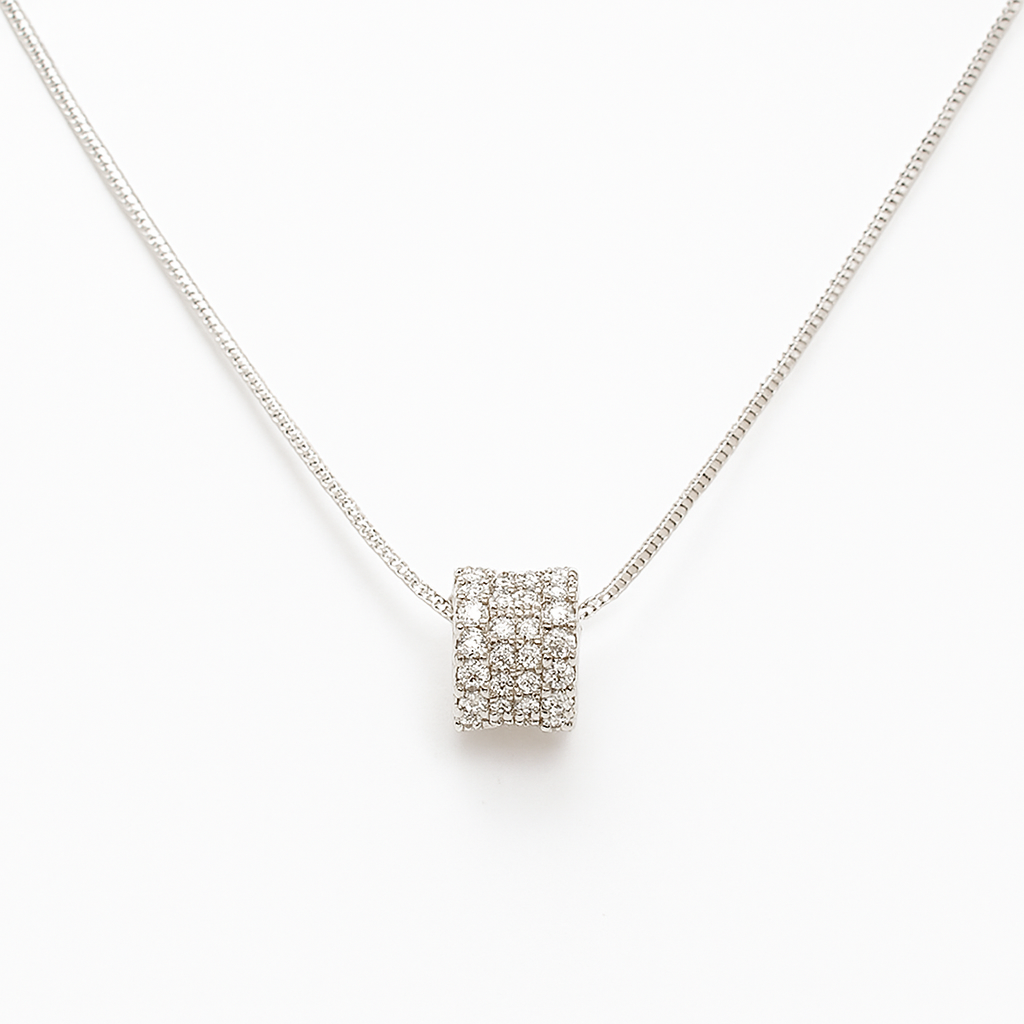 Silver necklace with a square pendant on a white background