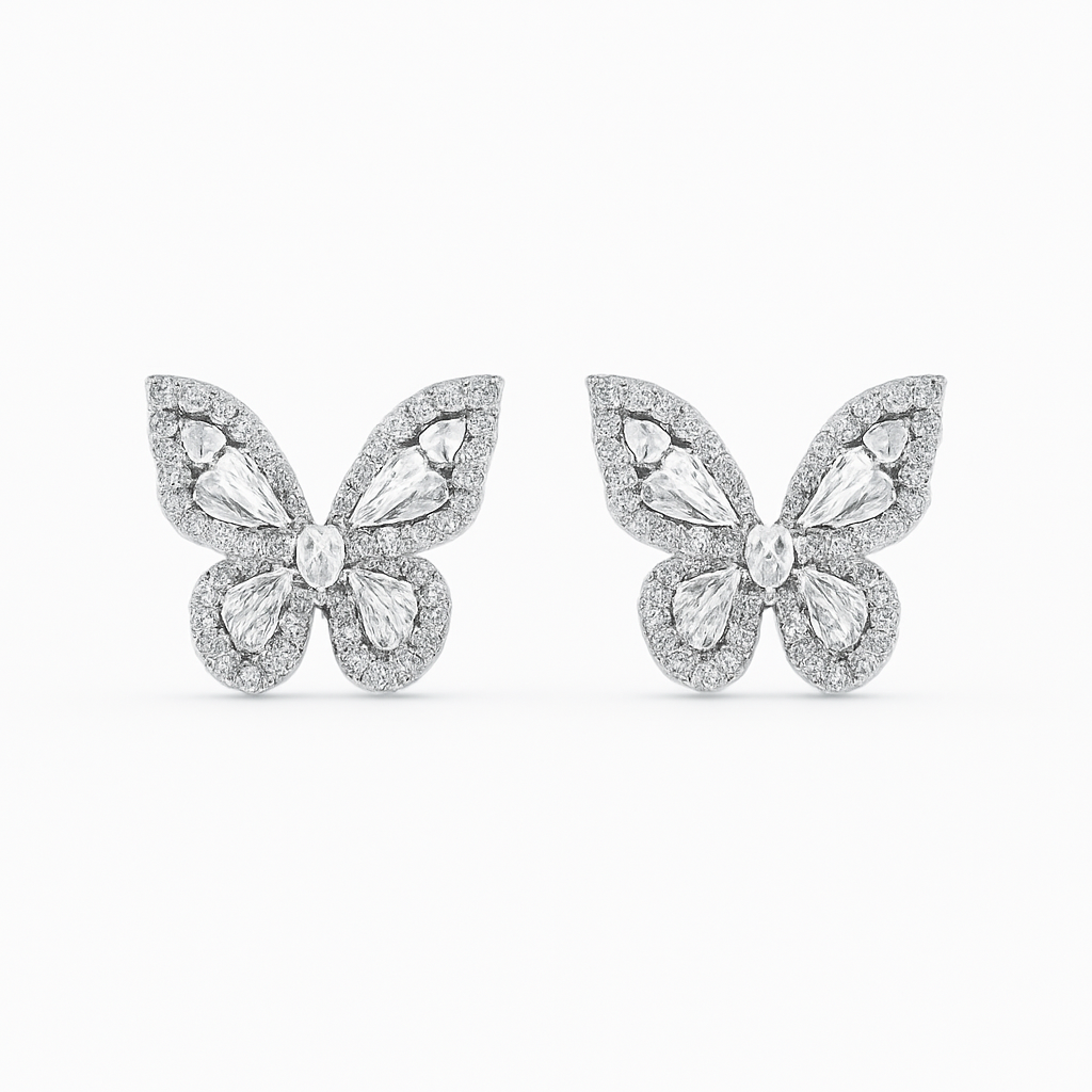 Butterfly-shaped earrings with gemstones on a white background
