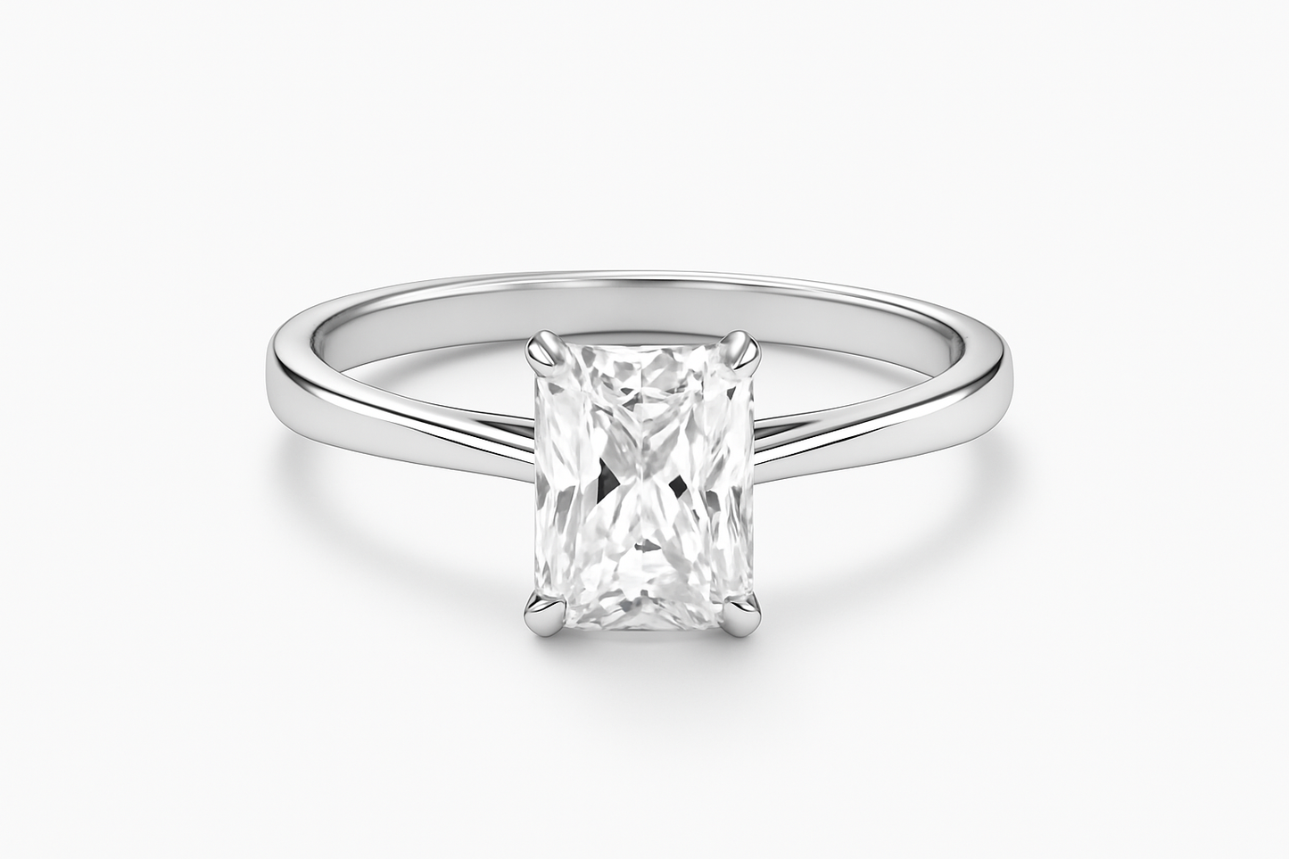 Silver ring with a rectangular diamond on a white background