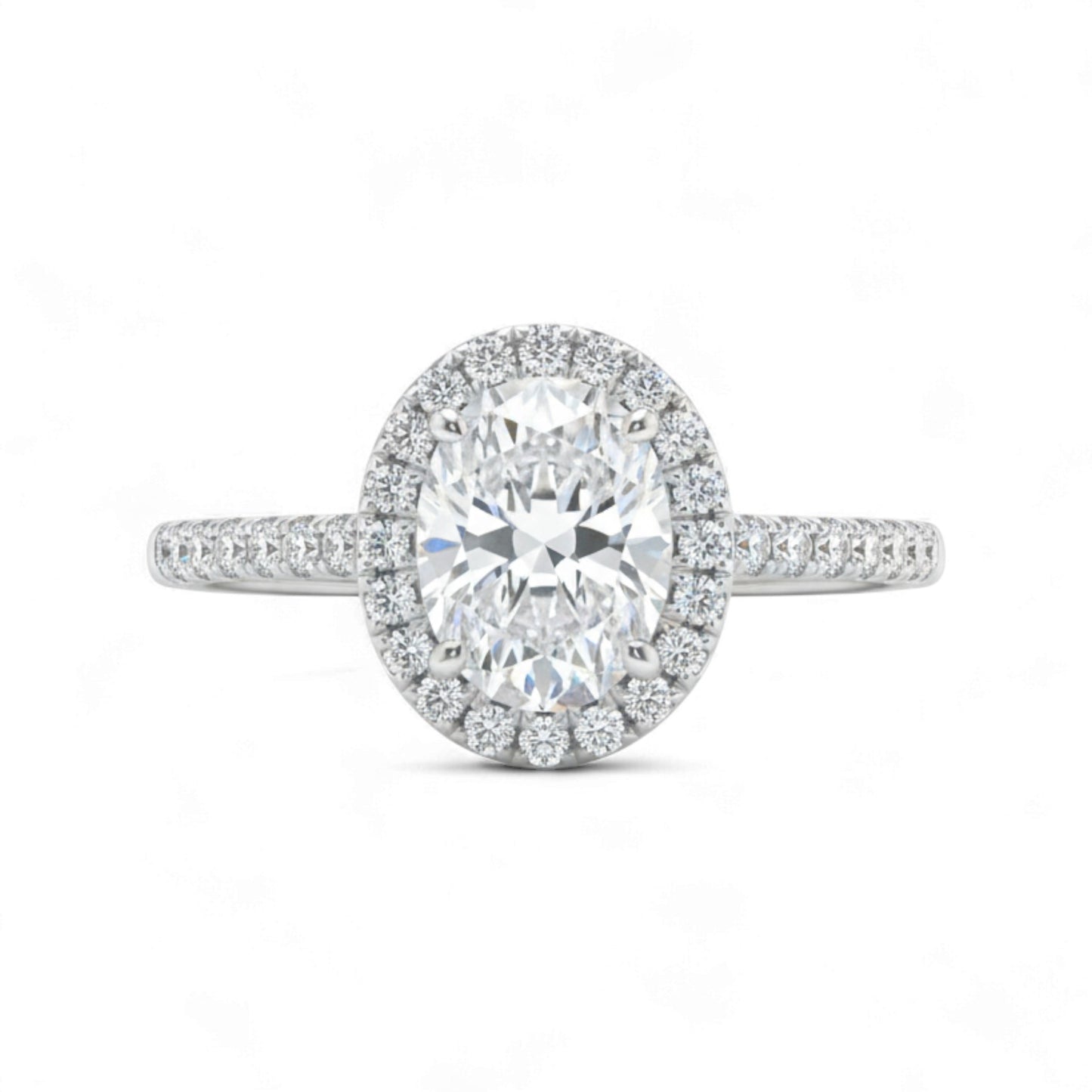 Diamond ring with a halo on a white background