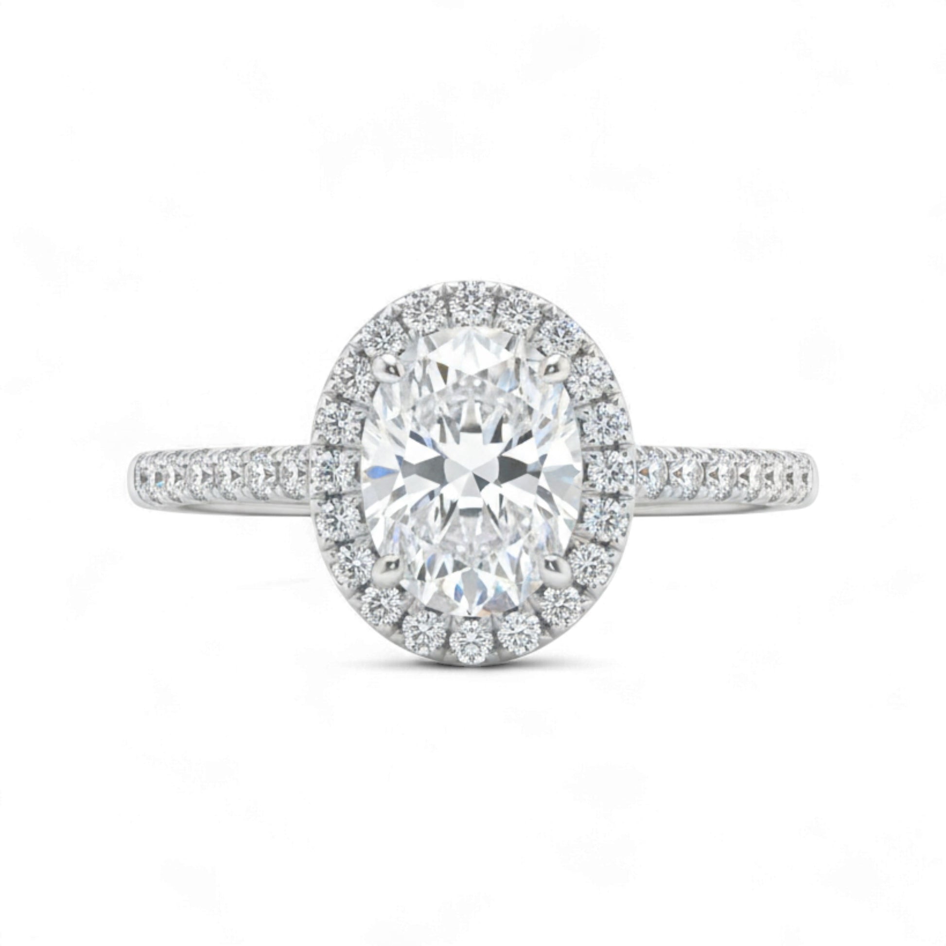 Diamond ring with a halo on a white background