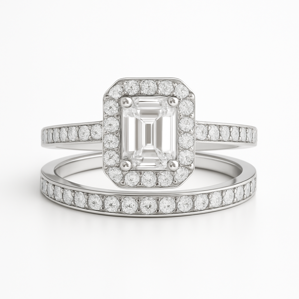 Diamond ring with emerald-cut center stone on a white background