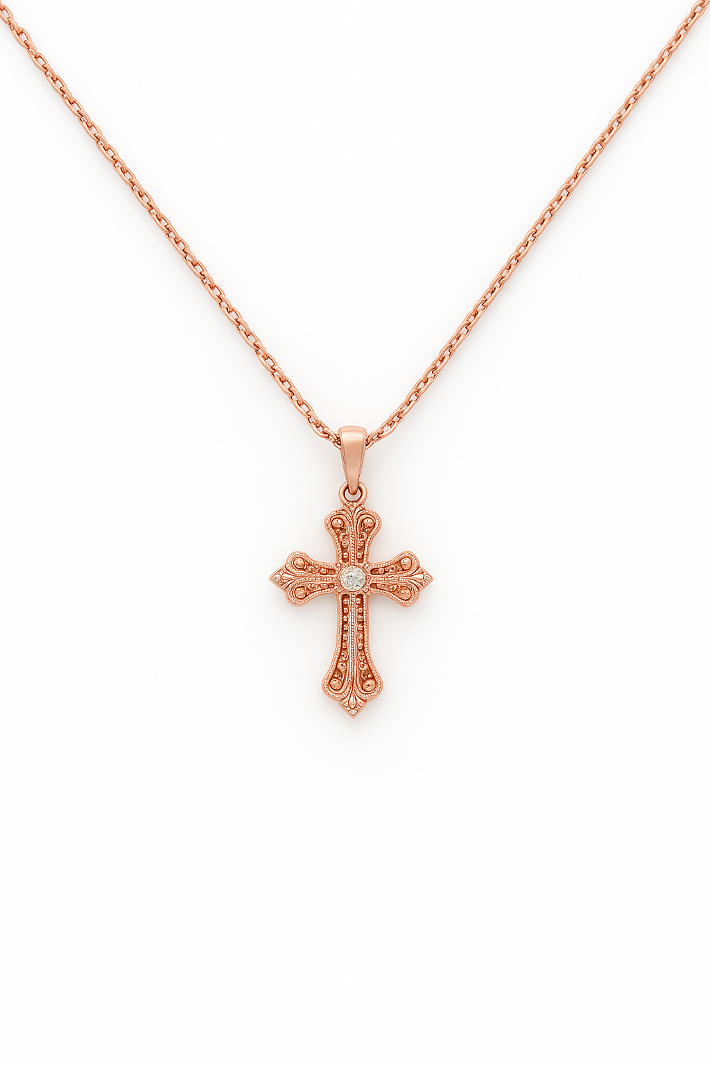 Rose gold cross necklace on a white background