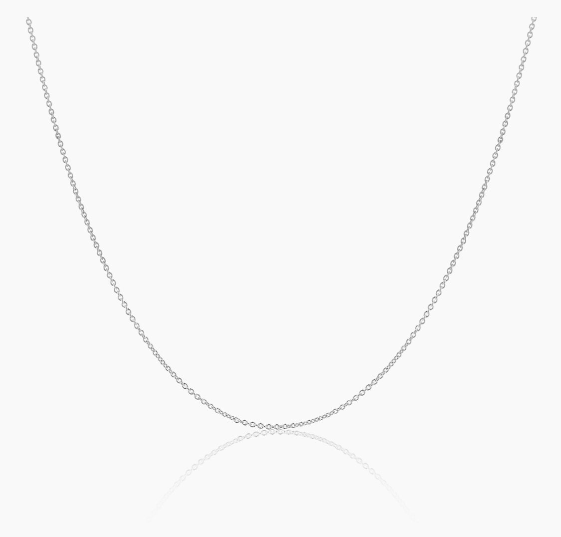 A dainty 18k gold chain necklace displayed against a white background.