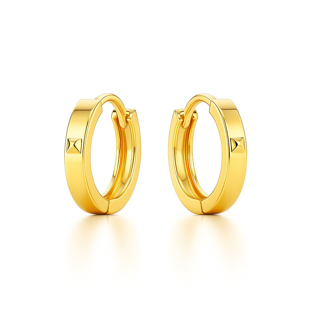 Gold hoop earrings on a white background