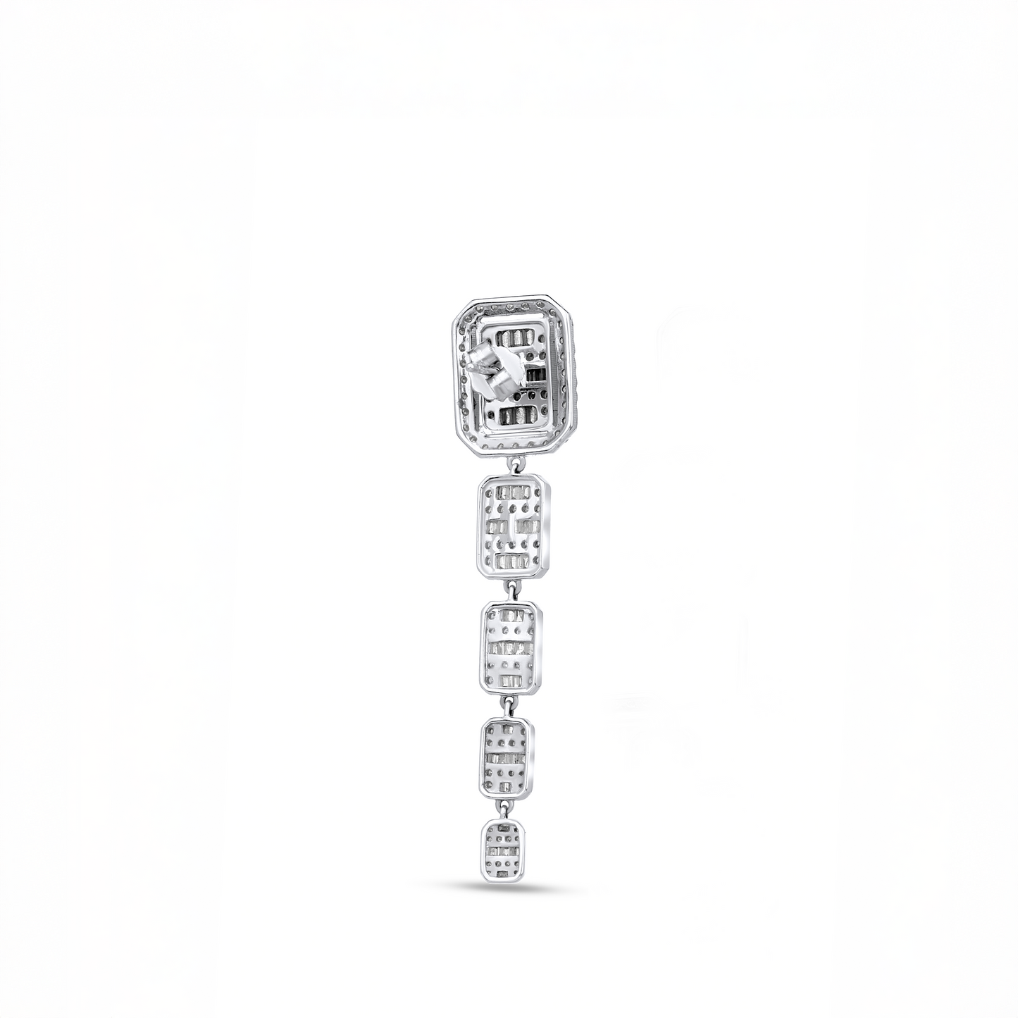 Silver earring with clear gemstones on a white background