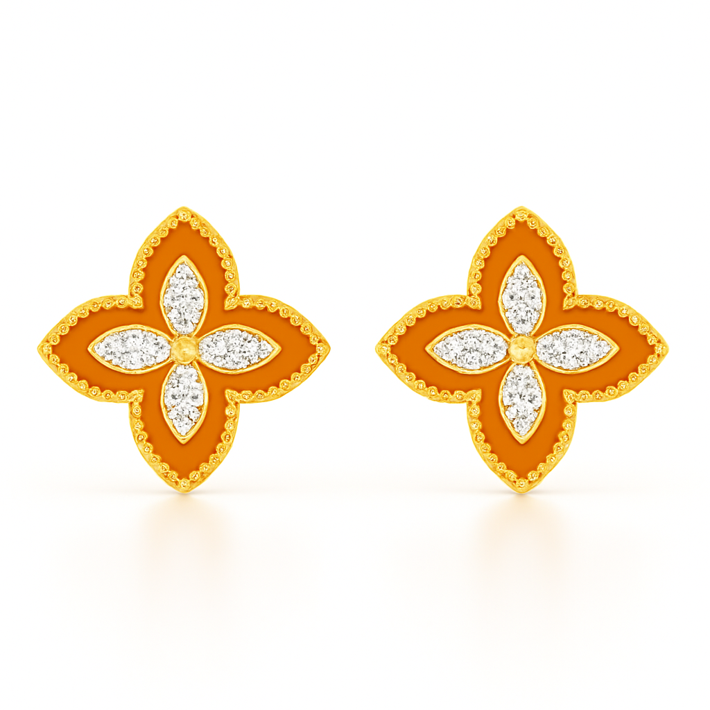 Pair of gold and orange flower-shaped earrings on a white background
