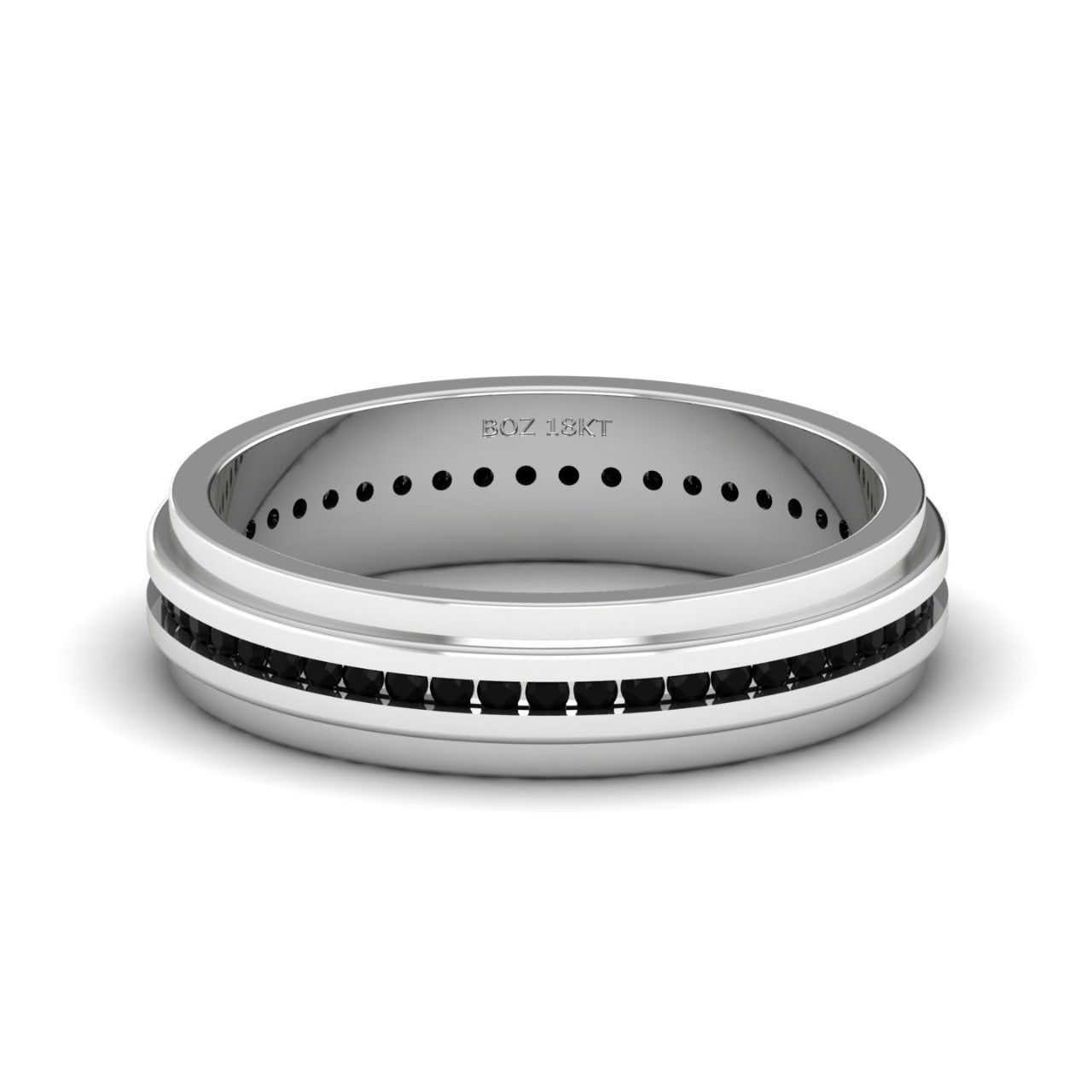 A 18K gold band ring with a textured surface and a black natural diamond center.