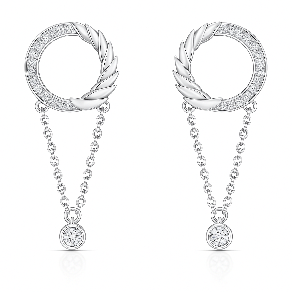 Pair of silver earrings with circular designs and dangling elements on a white background