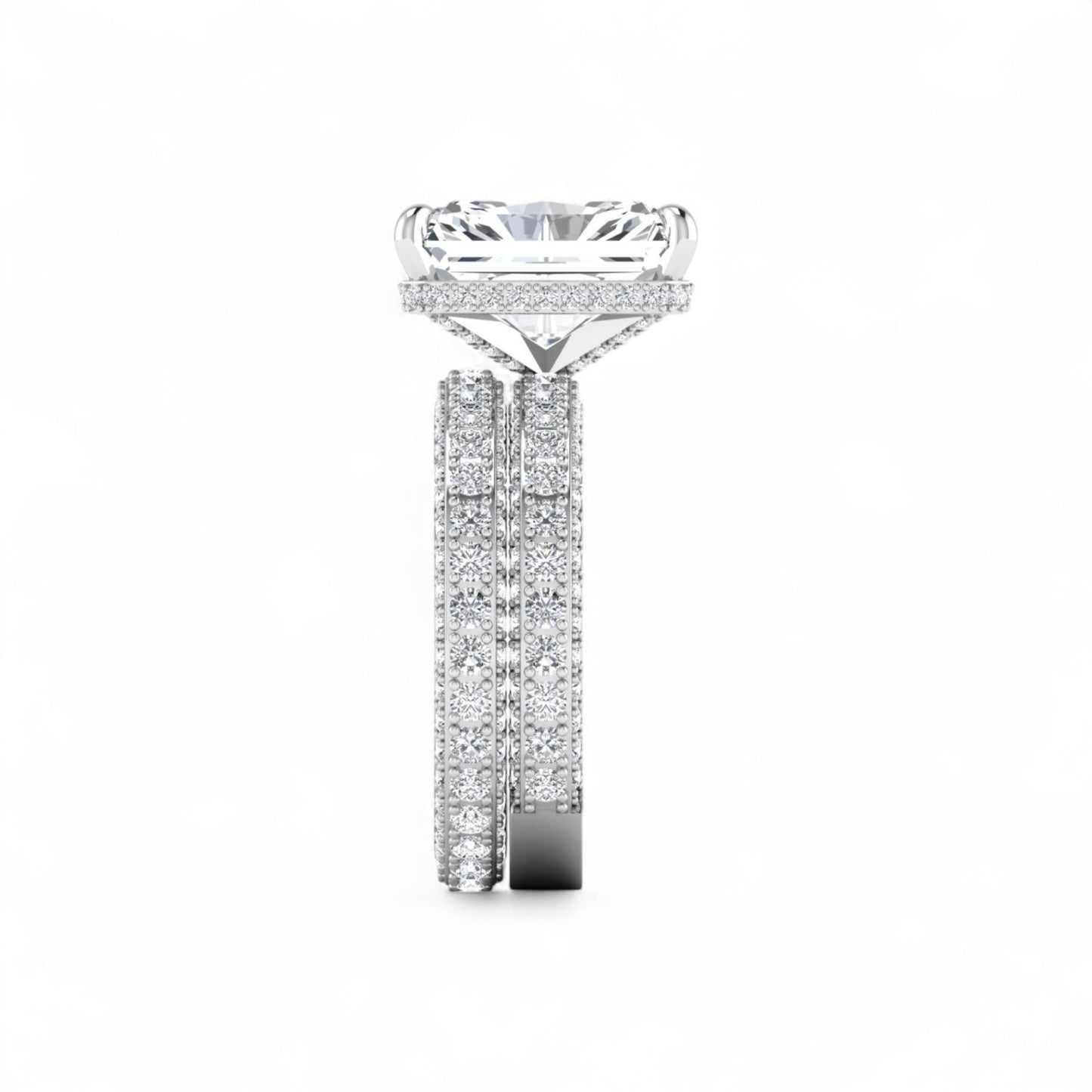 Diamond ring with a large central gemstone and smaller stones on the band against a white background