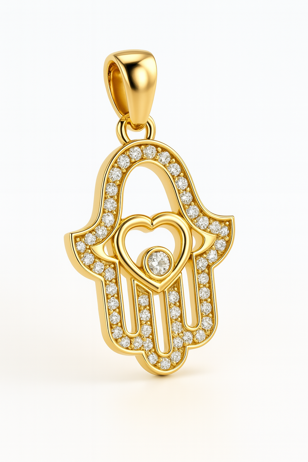 Gold pendant with Hamsa design and heart in the center on a white background