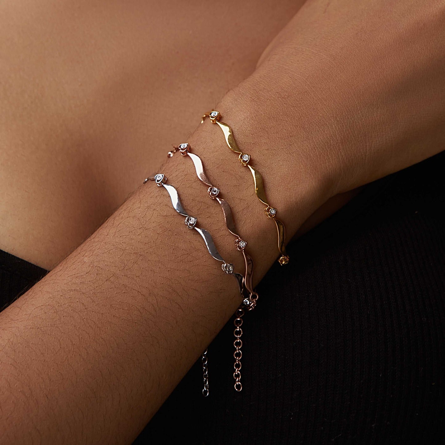4 Heart Diamond Bracelet in 18K gold with sparkling natural diamonds on wrist