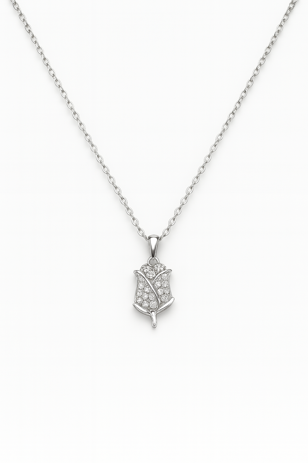 Silver necklace with a leaf-shaped pendant on a white background