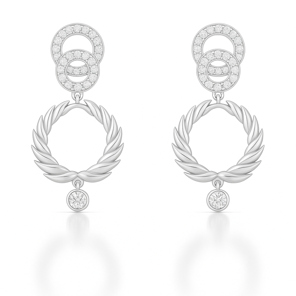 Pair of silver earrings with circular and leaf-like designs on a white background