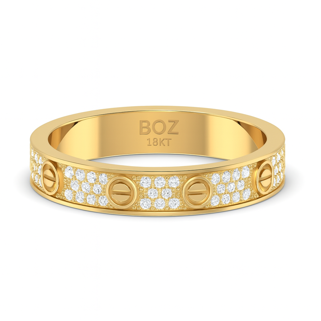 Gold ring with 'BOZ' branding and diamond accents on a white background