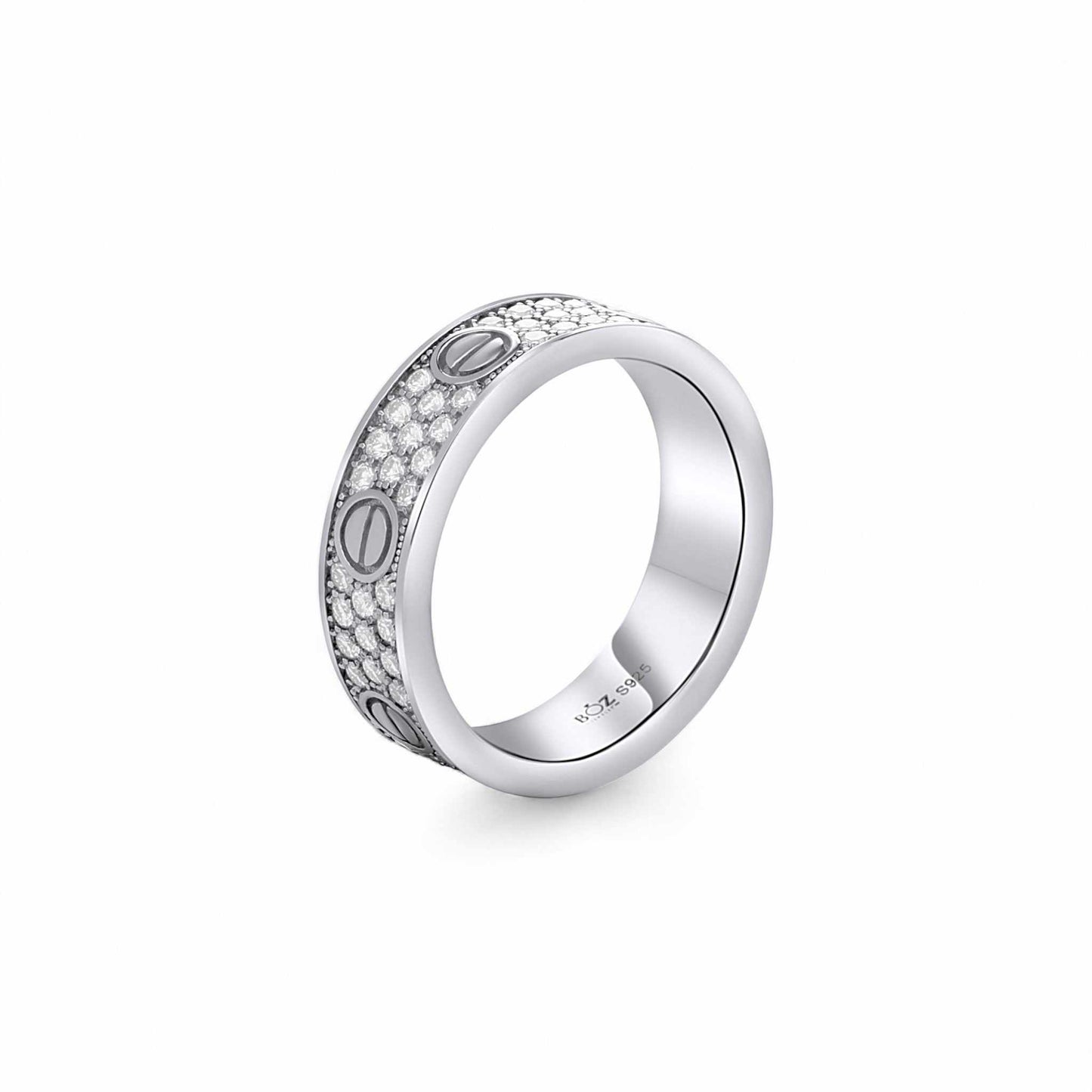 Silver ring with engraved design on a white background