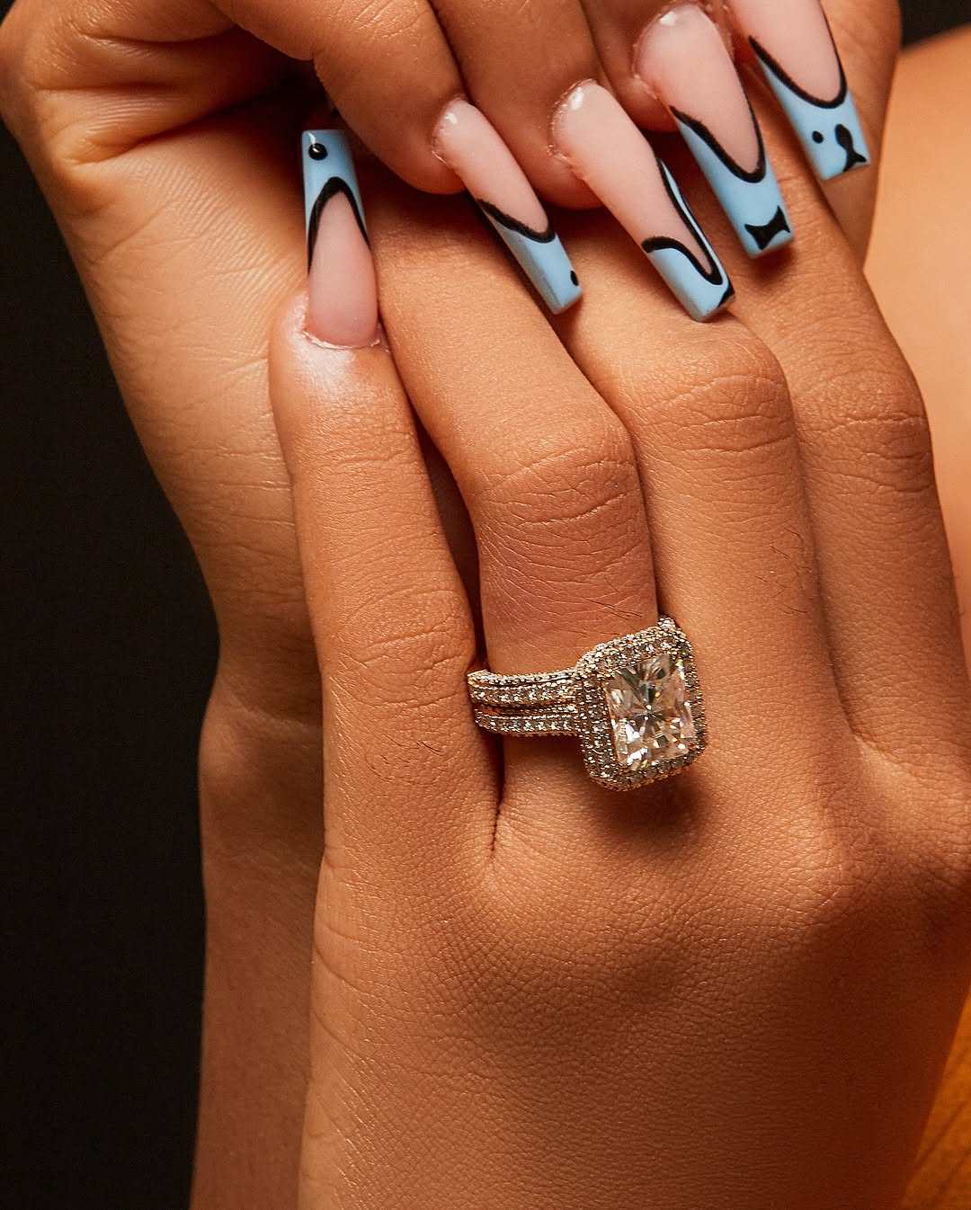 Naomi Radiant Cut Moissanite bridal ring set in 18K gold with halo pavé diamonds and triple-split shank design