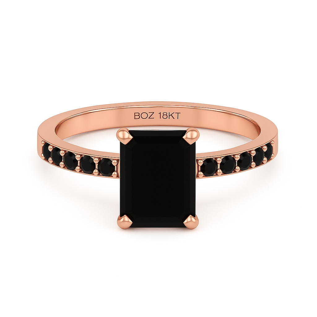 Rose gold ring with a black gemstone on a white background