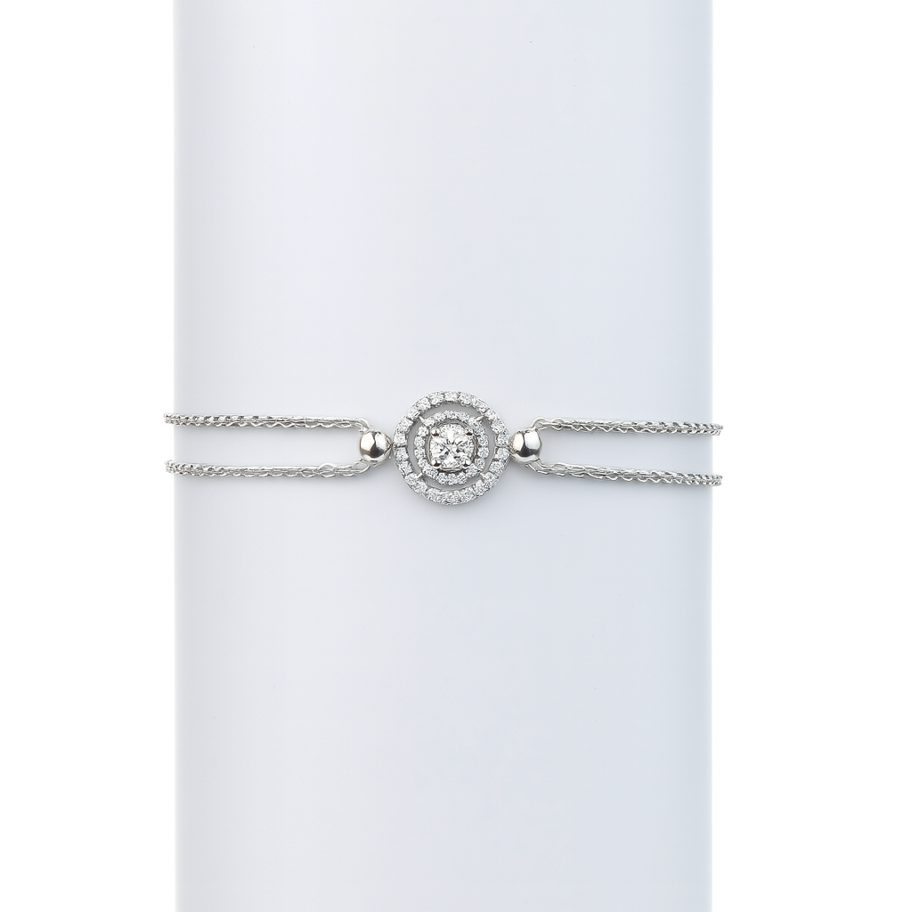 Silver bracelet with a diamond-like center on a light gray background