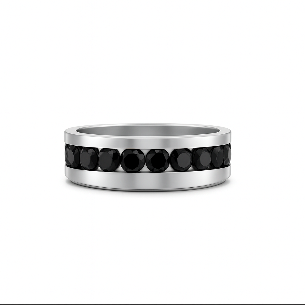 Silver ring with black gemstones on a white background