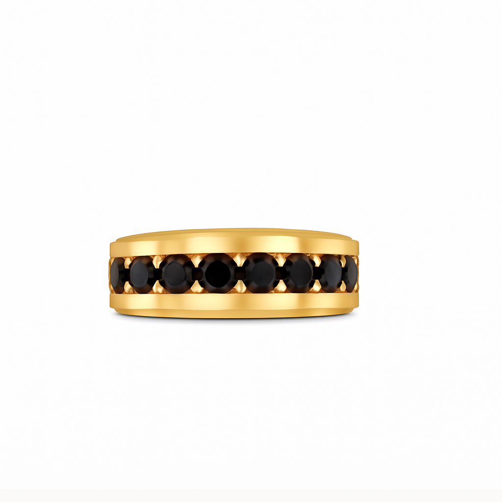 Gold ring with black gemstones on a white background